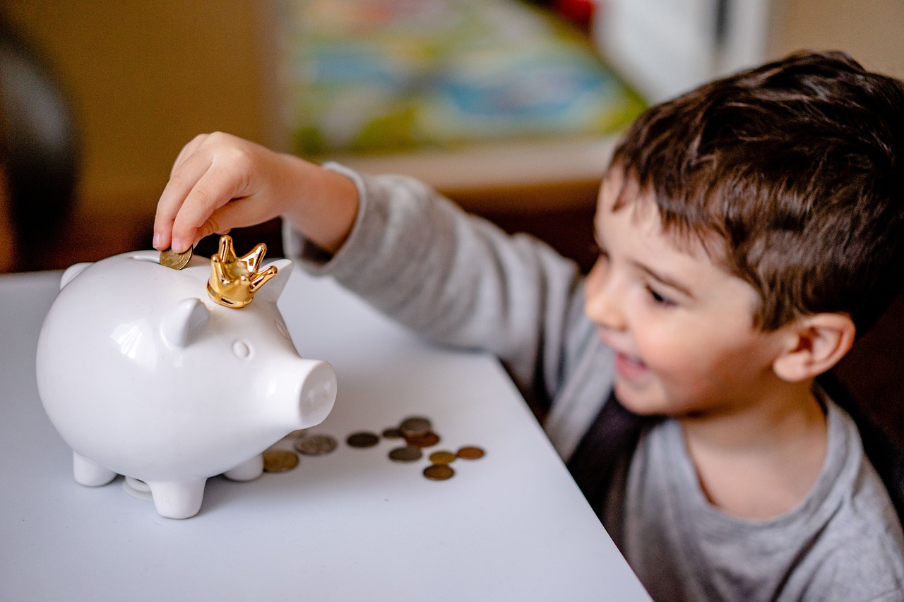 Age-by-Age Guide to Teaching Kids About Money (With Fun Activities!)