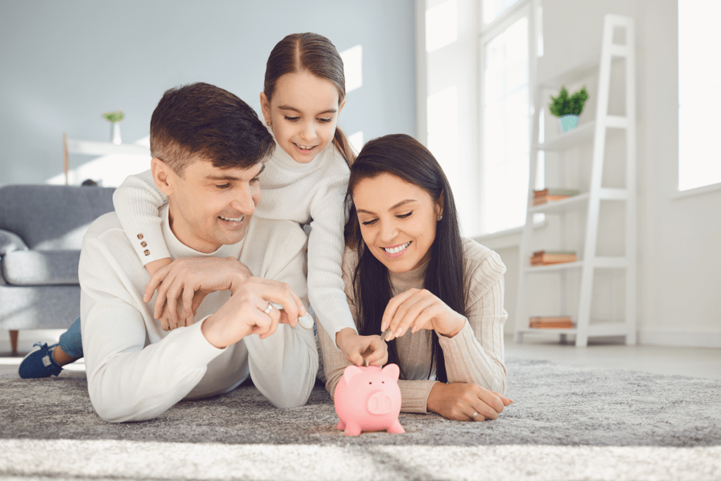 Parents teaching their daughter the importance of saving money as part of her financial literacy learning